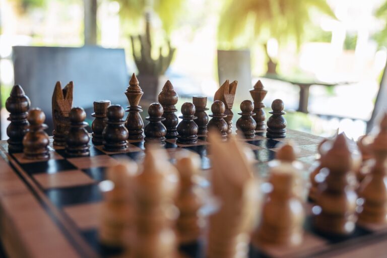 Closeup image of a wooden chess set on chessboard
